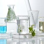 cosmetic laboratory research and development . science bio skincare cream serum product with leaves. natural organic beauty cosmetics concept. cosmetology.