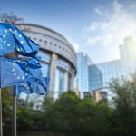European union flag against parliament in Brussels