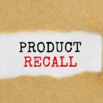 Text Product Recall appearing behind ripped brown paper.